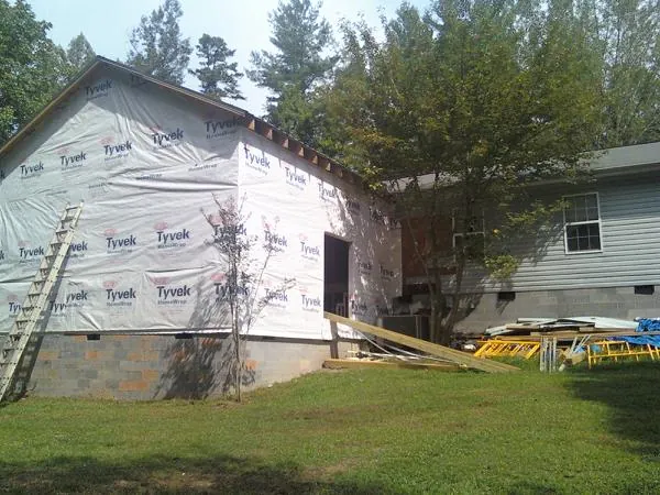 Tyvek wrapped gable on a new room addition beside an existing home in Christiansburg